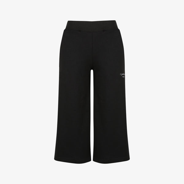 The female cropped joggers in black by z.james.c. Made from 100% cotton featuring a logo embroidery on the side.