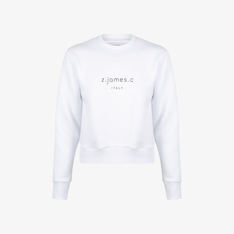 The white female cropped sweatshirt by the designer brand z.james.c. featuring a cropped fit and logo print on the chest