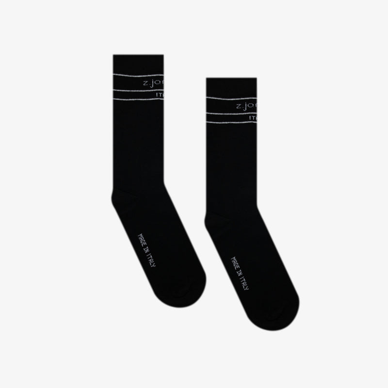 Black logo socks by the designer brand z.james.c captured on a white background.